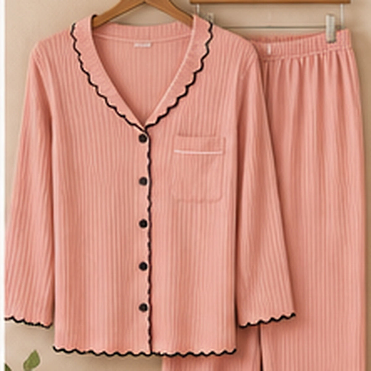 Pink ribbed bamboo pajama set on hangers